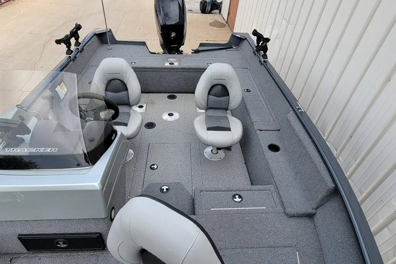 Slide: The Image of 2019 Tracker Pro Guide V-175 SC boat interior with storage compartments and control panel. - 12