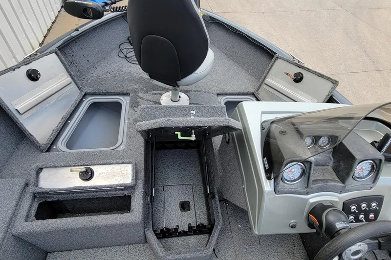 Slide: The Image of 2019 Tracker Pro Guide V-175 SC boat interior with storage compartment and rod holders. - 14