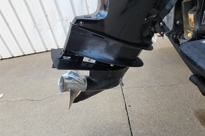Slide: The Image of 2019 Tracker Pro Guide V-175 SC boat with red and gray hull design. - 21