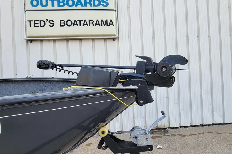 Slide: The Image of 2019 Tracker Pro Guide V-175 SC boat deck with motor and storage compartments. - 24