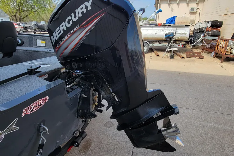 Slide: The Image of 2019 Tracker Pro Guide V-175 SC boat interior with steering console and seating. - 8