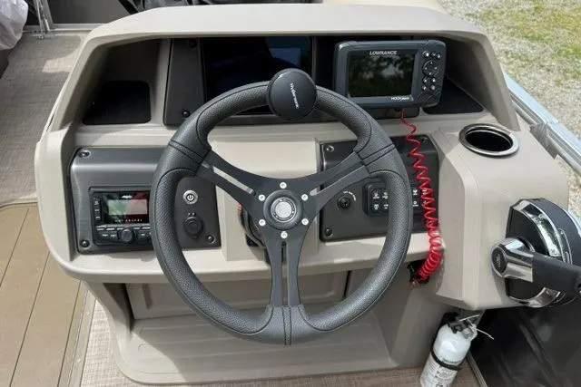Slide: The Image of 2024 Sun Tracker Party Barge 22 RF XP3 steering console with navigation and control systems. - 16