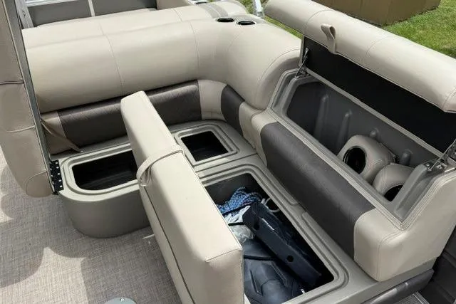 Slide: The Image of 2024 Sun Tracker Party Barge 22 RF XP3 interior storage compartments open, showcasing ample space. - 19