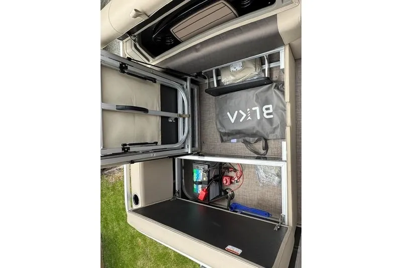 Slide: The Image of 2024 Sun Tracker Party Barge 22 RF XP3 storage compartment with organized equipment and accessories. - 21