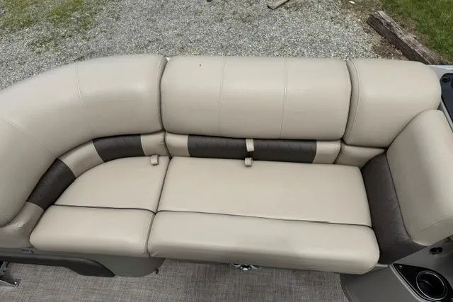 Slide: The Image of 2024 Sun Tracker Party Barge 22 RF XP3 beige and brown seating on pontoon boat. - 23