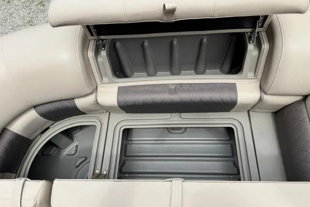 Slide: The Image of 2024 Sun Tracker Party Barge 22 RF XP3 storage compartments with cushioned seating. - 24