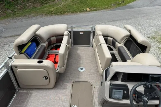 Slide: The Image of 2024 Sun Tracker Party Barge 22 RF XP3 interior with spacious seating and storage compartments. - 25