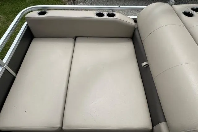 Slide: The Image of 2024 Sun Tracker Party Barge 22 RF XP3 beige seating with cup holders. - 9