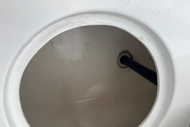 Slide: The Image of Circular compartment with hose inside a 1996 Sea Ray Laguna 24 Flushdeck Cuddy boat. - 10