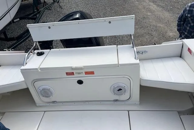 Slide: The Image of 1996 Sea Ray Laguna 24 Flushdeck Cuddy boat interior with seating and storage compartments. - 11