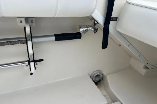 Slide: The Image of Interior view of a 1996 Sea Ray Laguna 24 Flushdeck Cuddy boat, featuring seating and equipment. - 14