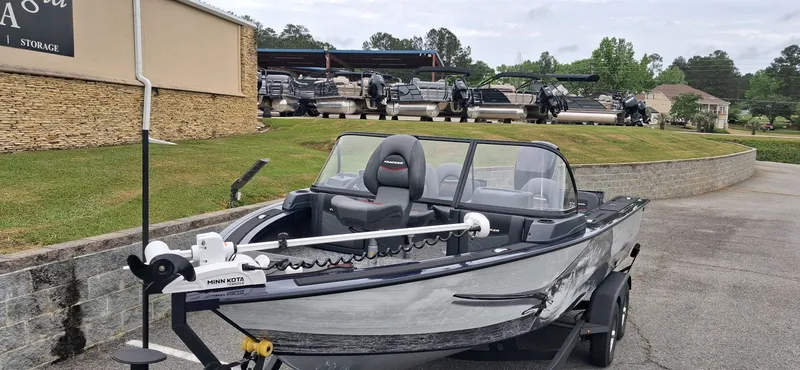 Slide: The Image of 2025 Tracker Targa V-19 Combo boat in a parking lot. - 10