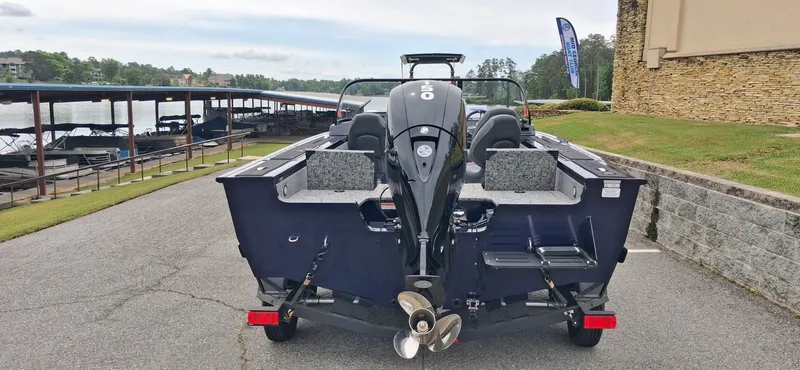 Slide: The Image of 2025 Tracker Targa V-19 Combo boat at dock with outboard motor. - 15