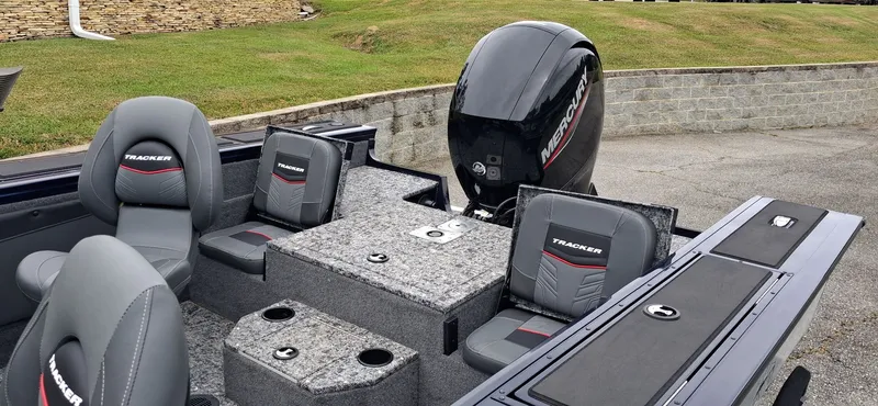 Slide: The Image of 2025 Tracker Targa V-19 Combo boat with gray seats and Mercury engine. - 3