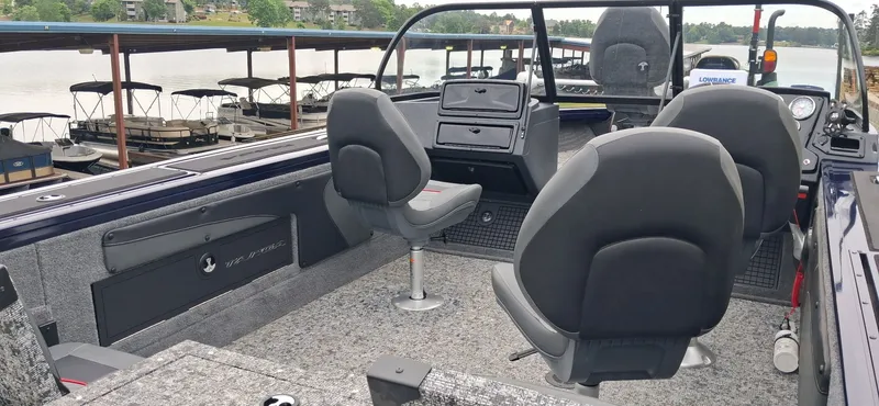 Slide: The Image of Interior of 2025 Tracker Targa V-19 Combo with gray seats. - 5