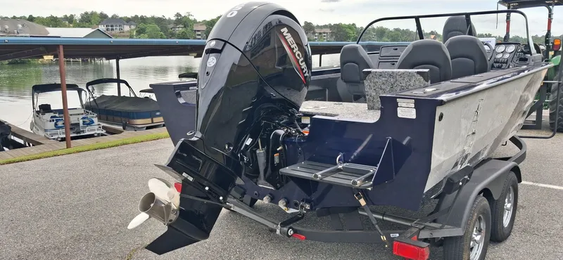 Slide: The Image of 2025 Tracker Targa V-19 Combo boat at dock with Mercury engine. - 6