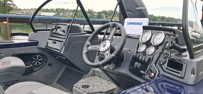 Slide: The Image of Interior of 2025 Tracker Targa V-19 Combo with steering and gauges. - 8