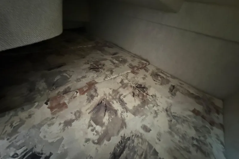 Slide: The Image of Interior cabin of 1997 Sea Ray 240 Sundancer with patterned upholstery. - 9