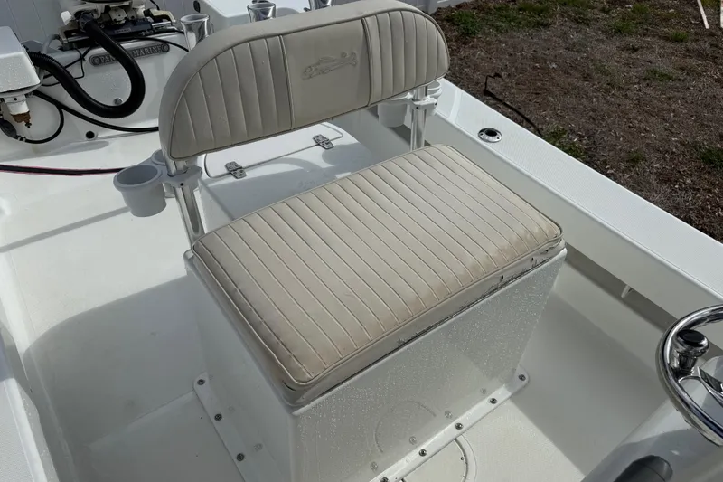 Slide: The Image of 2016 Panga 22 BOCA GRANDE boat seat with beige upholstery and cup holders. - 15