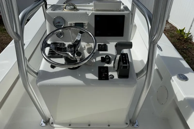 Slide: The Image of 2016 Panga 22 Boca Grande boat console with steering wheel and controls. - 18