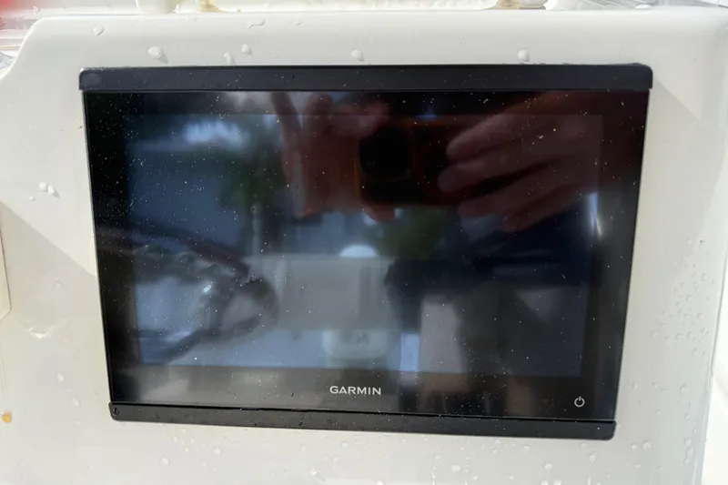 Slide: The Image of Garmin display on 2016 Panga 22 BOCA GRANDE boat, showing reflections and water droplets. - 19