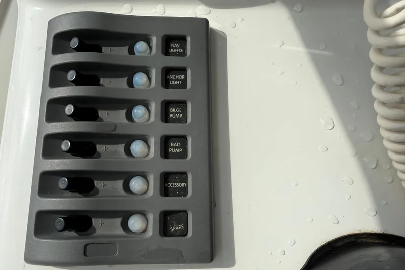 Slide: The Image of Control panel of a 2016 Panga 22 BOCA GRANDE boat with labeled switches. - 21