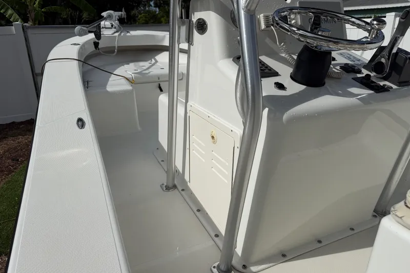 Slide: The Image of 2016 Panga 22 Boca Grande boat interior with steering console and controls. - 25