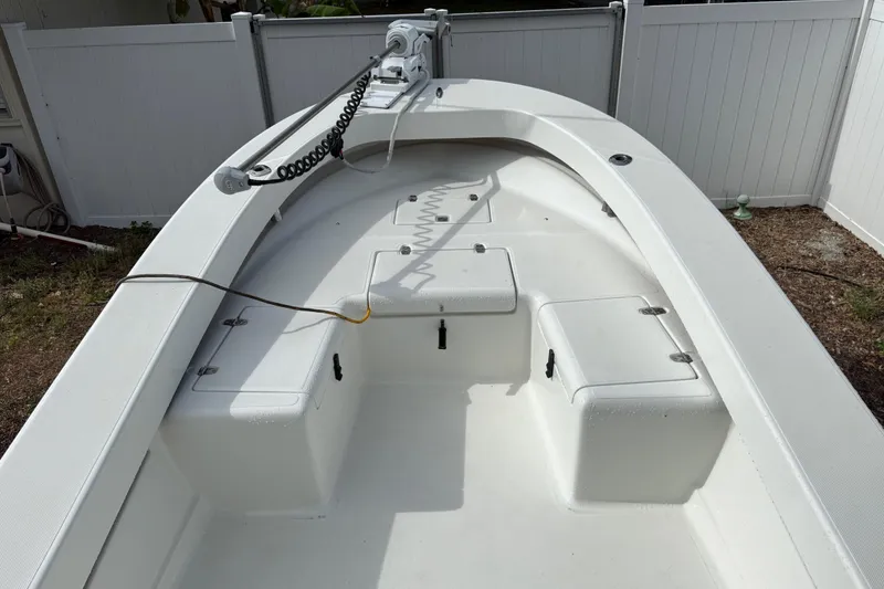 Slide: The Image of 2016 Panga 22 Boca Grande boat interior with storage compartments and anchor setup. - 29