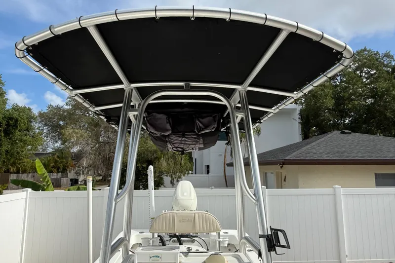 Slide: The Image of 2016 Panga 22 Boca Grande boat with T-top in residential setting. - 32
