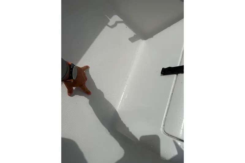 Slide: The Image of Hand touching the deck of a 2016 Panga 22 BOCA GRANDE boat. - 34