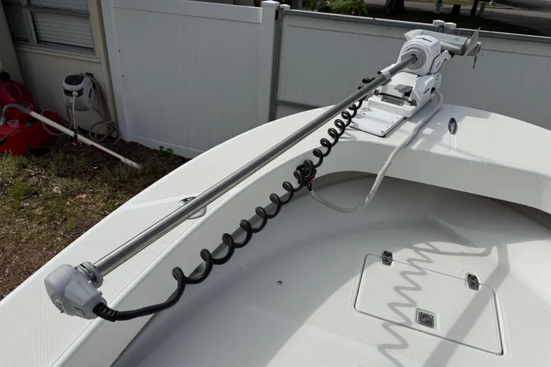 Slide: The Image of 2016 Panga 22 Boca Grande boat with mounted trolling motor on deck. - 38
