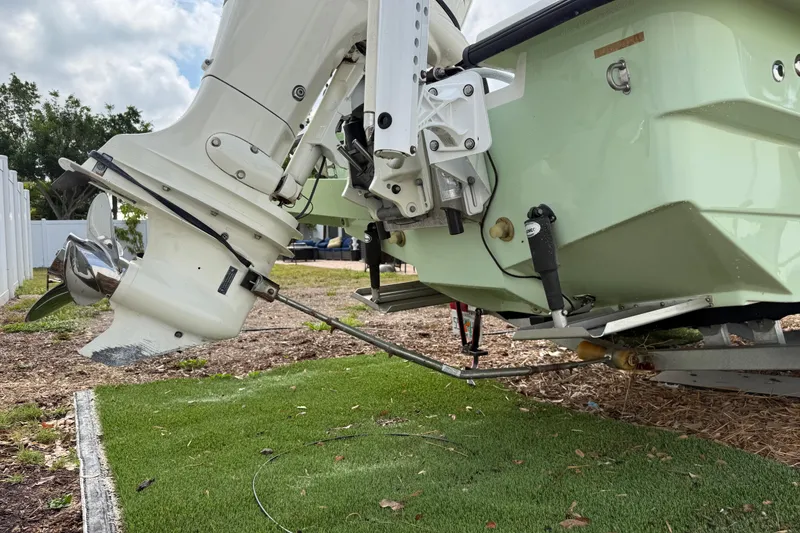 Slide: The Image of 2016 Panga 22 BOCA GRANDE boat engine and propeller on display outdoors. - 44