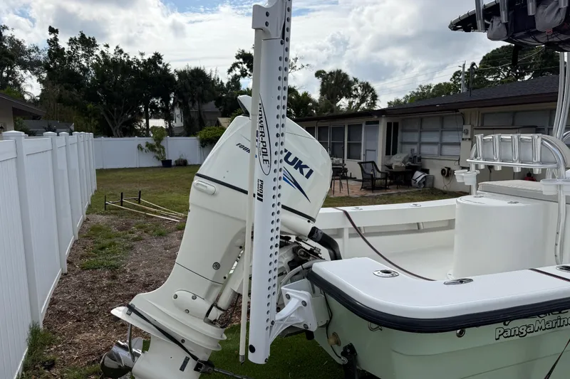 Slide: The Image of 2016 Panga 22 BOCA GRANDE boat with Suzuki outboard motor in a residential yard. - 5