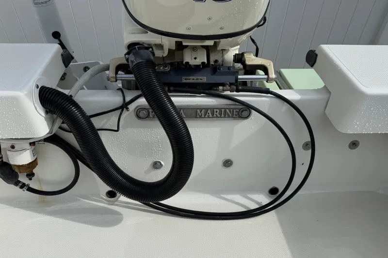 Slide: The Image of 2016 Panga 22 BOCA GRANDE boat engine area with cables and fittings. - 9