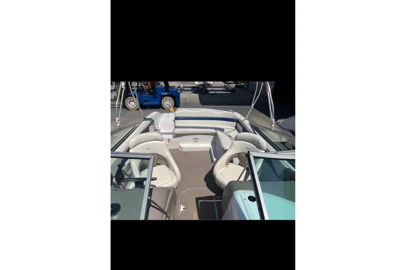 Slide: The Image of 2002 Four Winns 240 Horizon boat interior with seating and steering wheel. - 5