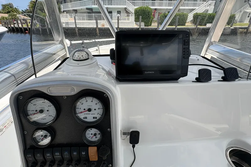 Slide: The Image of Bow of 2013 Seahunt Triton 225 with Minn Kota trolling motor on calm water. - 23