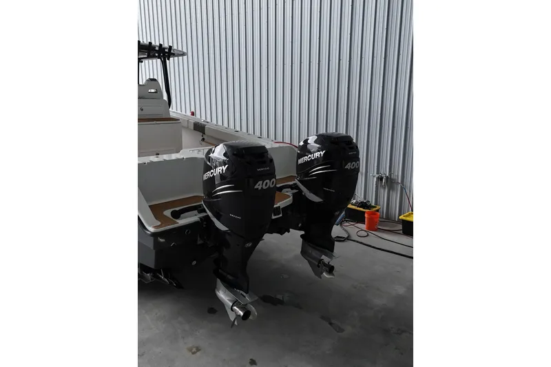 Slide: The Image of Freeman 34VH 2019 boat with dual Mercury 400 outboard engines in a garage. - 14