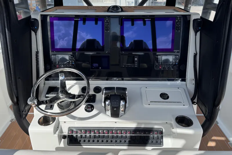 Slide: The Image of Helm of 2019 Freeman 34VH boat with dual Simrad displays and steering wheel. - 5