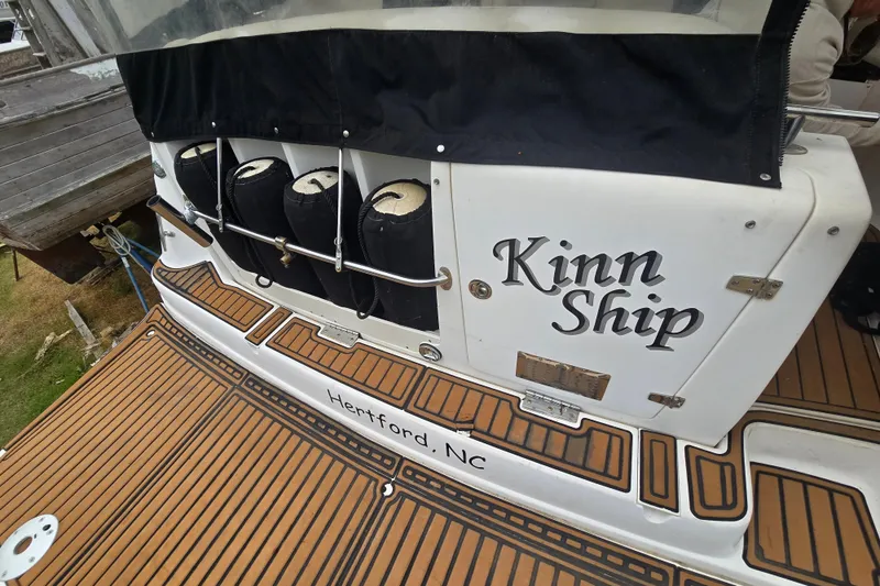 Slide: The Image of 2003 Rinker Fiesta Vee 342 boat with "Kinn Ship" name, docked in Hertford, NC. - 12