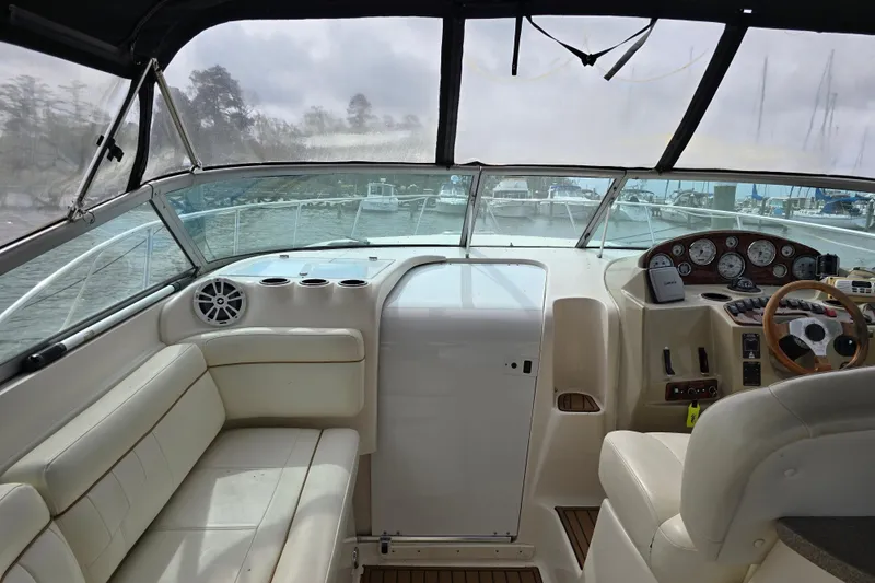 Slide: The Image of 2003 Rinker Fiesta Vee 342 boat interior with helm, seating, and dashboard controls. - 13