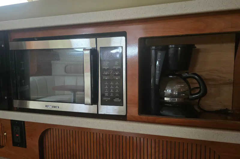 Slide: The Image of Microwave and coffee maker in 2003 Rinker Fiesta Vee 342 yacht kitchen. - 25