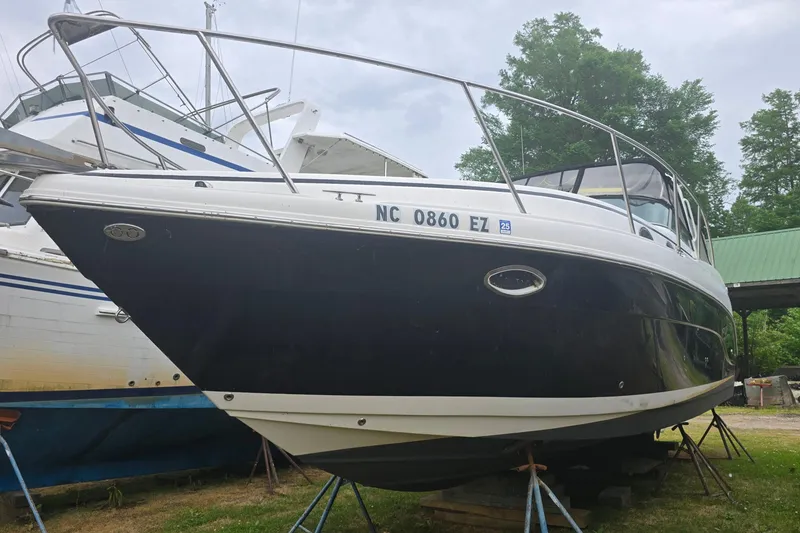 Slide: The Image of 2003 Rinker Fiesta Vee 342 boat on stands, side view, outdoors. - 4