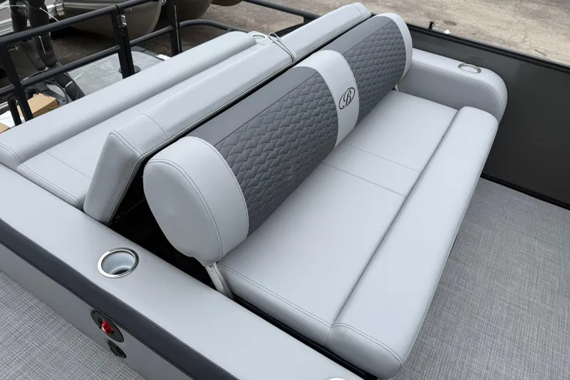 Slide: The Image of 2026 Bentley Pontoons Elite 253 Swingback with luxurious gray seating and cup holders. - 12