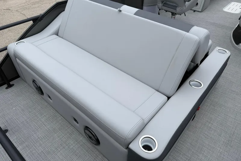 Slide: The Image of 2026 Bentley Pontoons Elite 253 Swingback with sleek gray seating and integrated cup holders. - 14