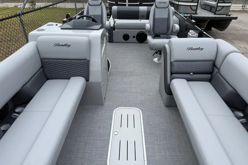 Slide: The Image of 2026 Bentley Pontoons Elite 253 Swingback interior with luxurious seating and modern design. - 2
