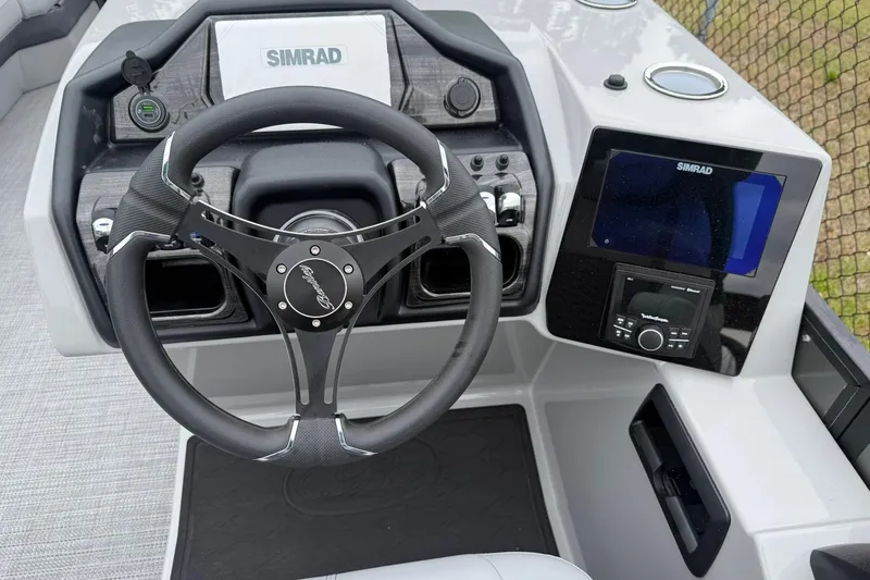 Slide: The Image of Steering console of 2026 Bentley Pontoons Elite 253 Swingback with Simrad display. - 6
