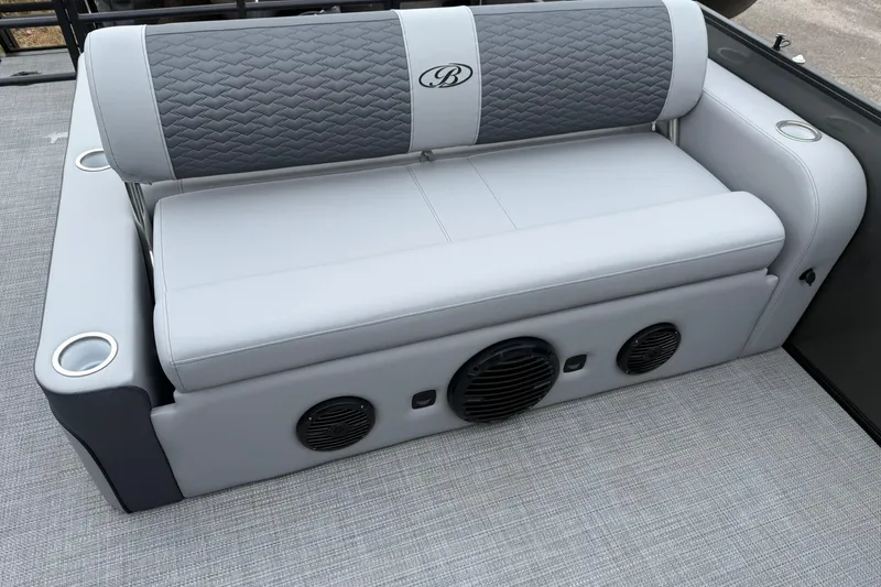 Slide: The Image of 2026 Bentley Pontoons Elite 253 Swingback seating with integrated speakers and cup holders. - 7