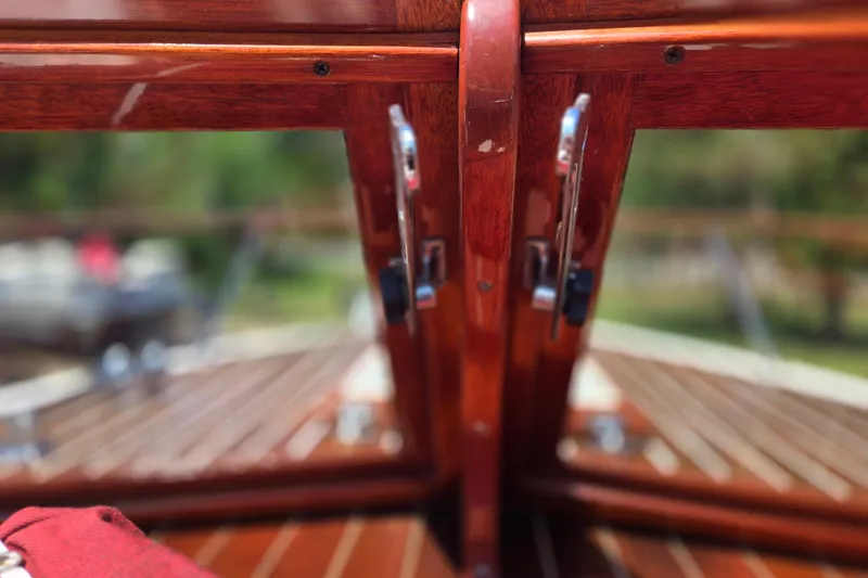 Slide: The Image of Close-up of 1990 Windsor Craft Cuddy boat's polished wooden deck details. - 17