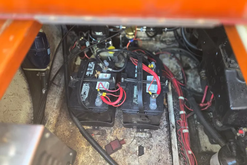 Slide: The Image of Battery compartment of a 1990 Windsor Craft Cuddy boat, showing wiring and connections. - 20