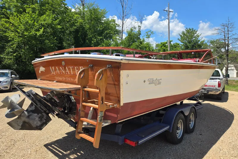 Slide: The Image of 1990 Windsor Craft Cuddy boat on trailer, wooden finish, outdoors, sunny day. - 7